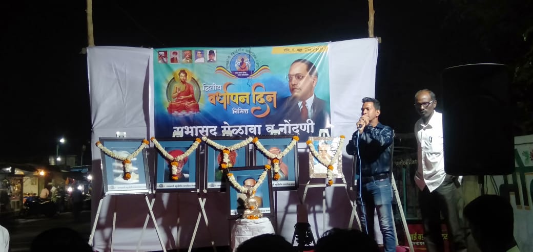 Dhammakaranti event on stage with banners